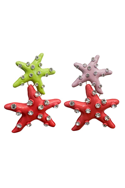 Asymmetrical large starfish earrings with vibrant color contrast: one side flaunts green and pink starfish, while the other showcases purple and pink. Silver scattered diamantes add a touch of sparkle, creating a unique and eye-catching accessory